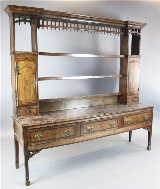 A George III mahogany banded oak dresser, W.6ft 10in. D.1ft 8in. H.6ft 5in.